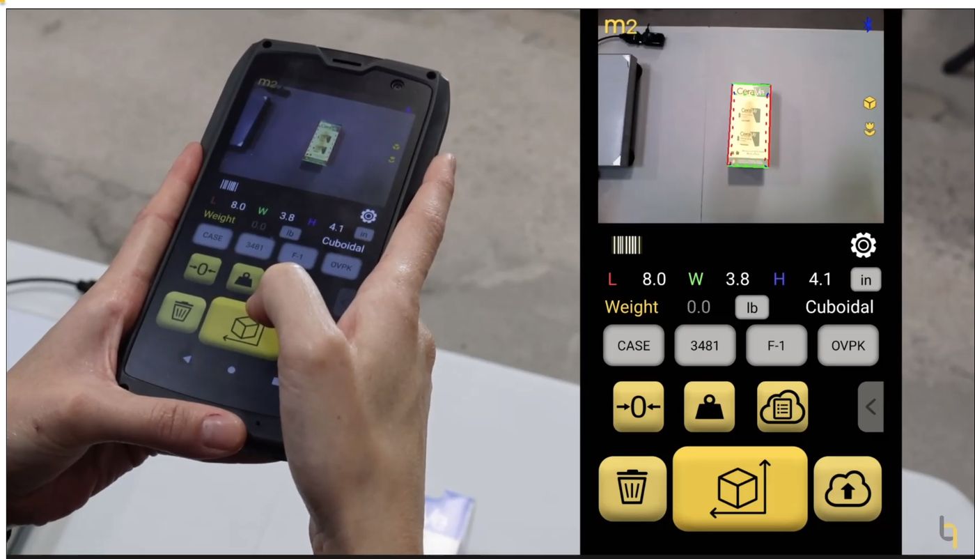 Hands holding the M2; the app shows L 8.0, W 3.8, H 4.1 in and Cuboidal