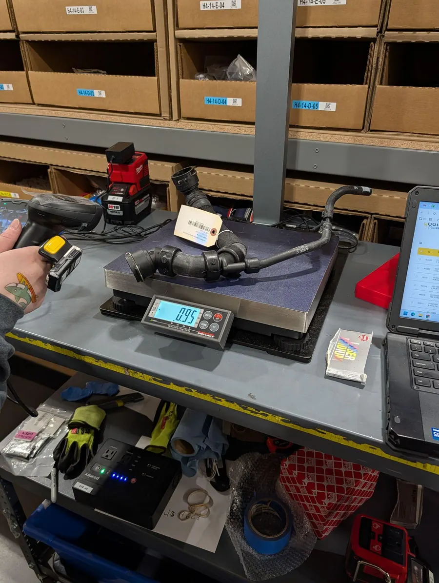 A rubber hose with a tag on the S1 scale, scanner in hand